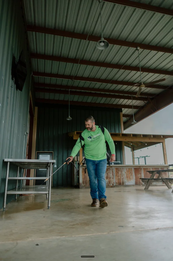 Jason treating a commercial outdoor pavilion in Brazos Valley.